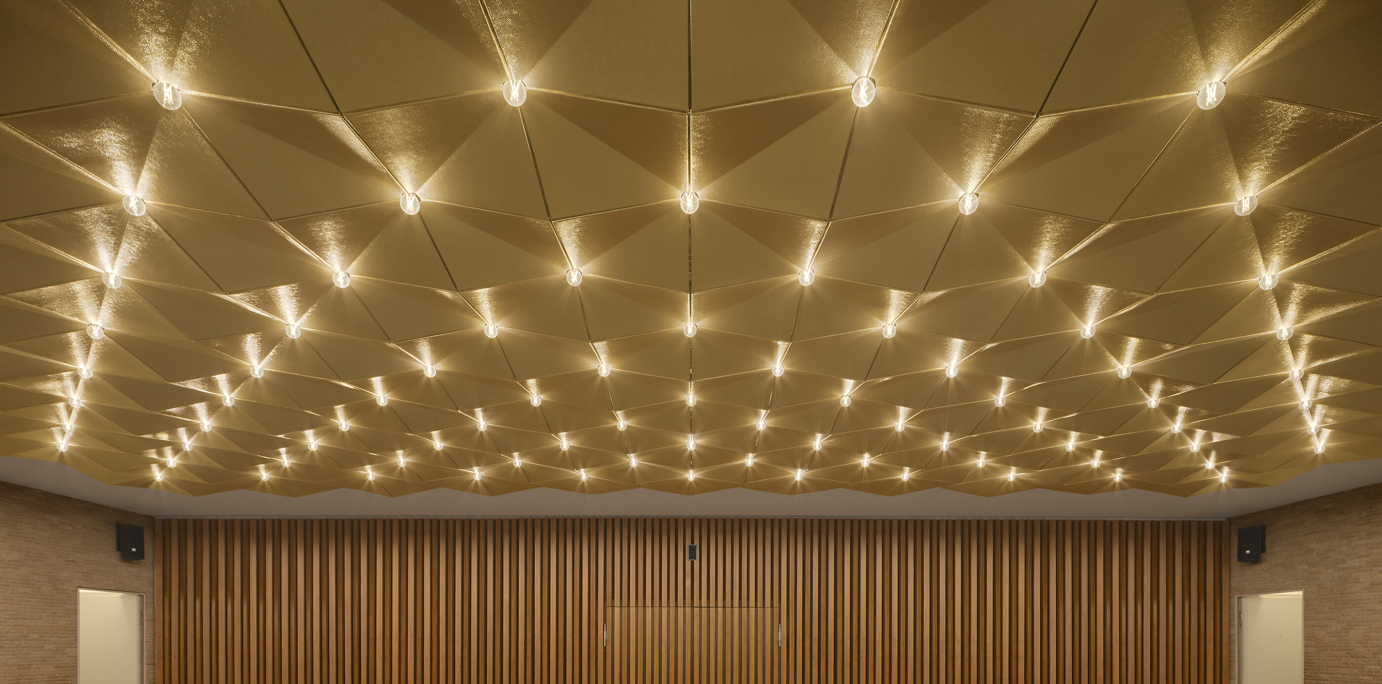 The restored gilded golden ceiling in the foyer of Kino International